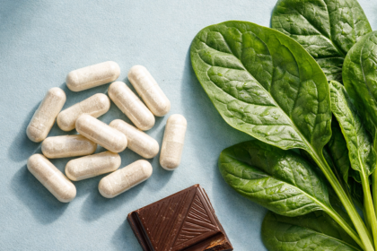 Magnesium Glycinate supplement next to spinach, showing essential mineral for energy.
