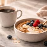 A small protein-rich breakfast snack served next to a morning cup of coffee to improve energy levels.